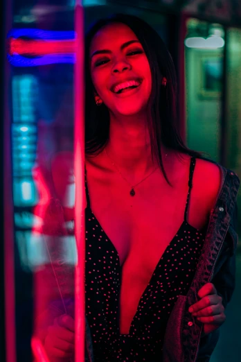 a girl is smiling in the mirror with some lights
