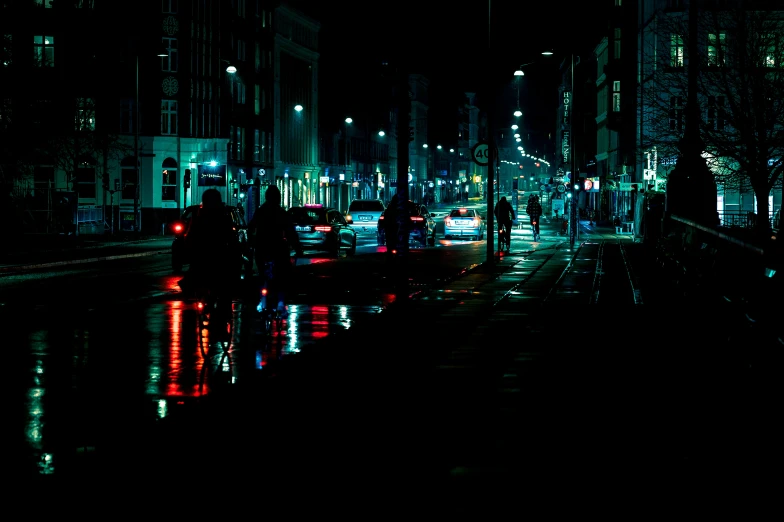 a city street with traffic lights at night