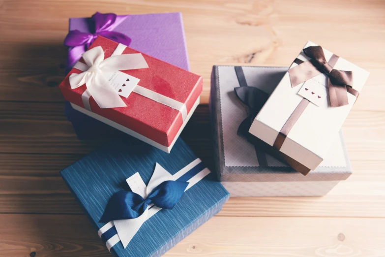 three wrapped presents are sitting next to each other