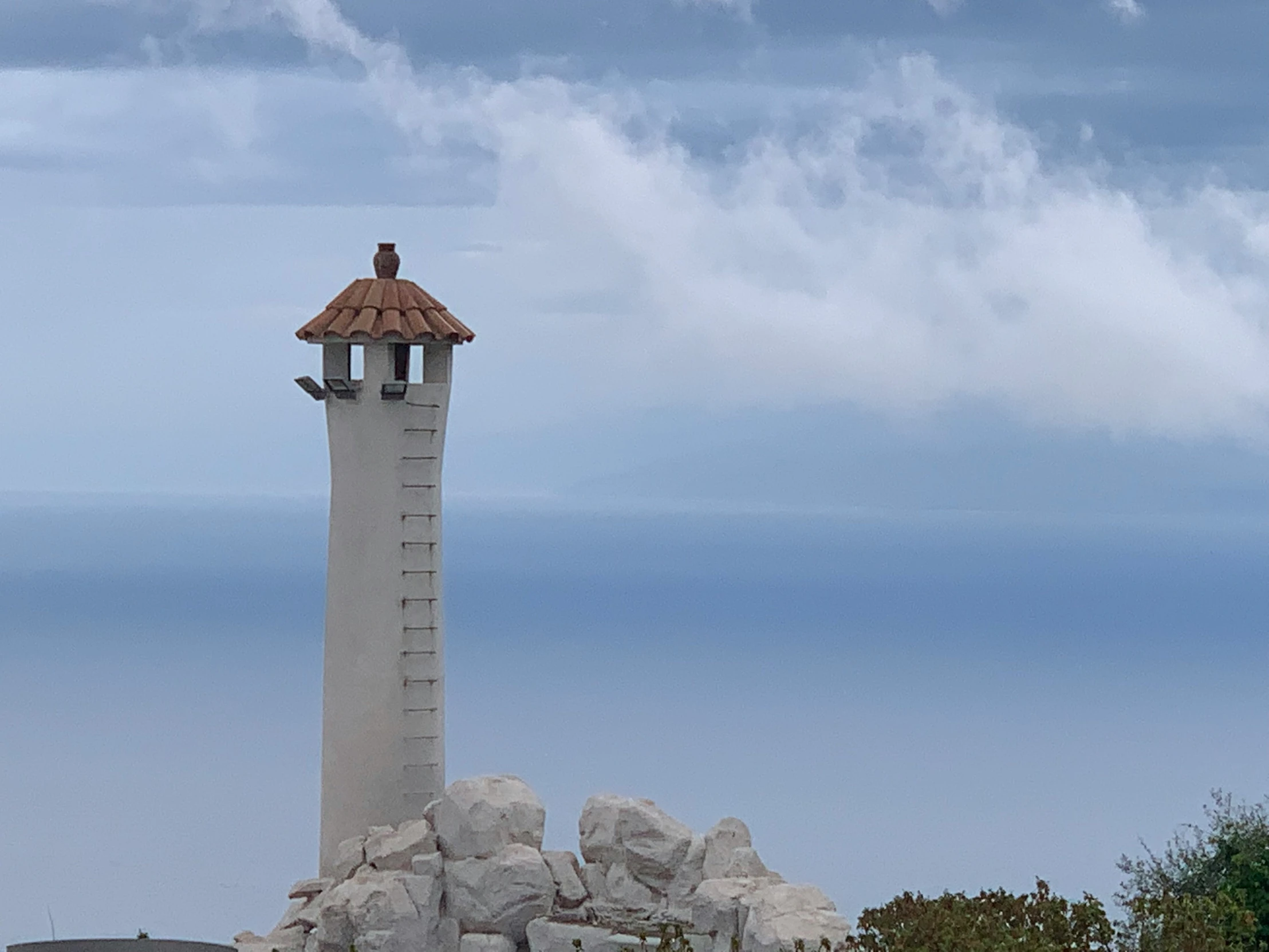 an image of a light house near the ocean