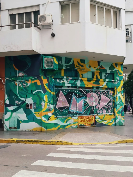 a building painted in an urban style with various colors