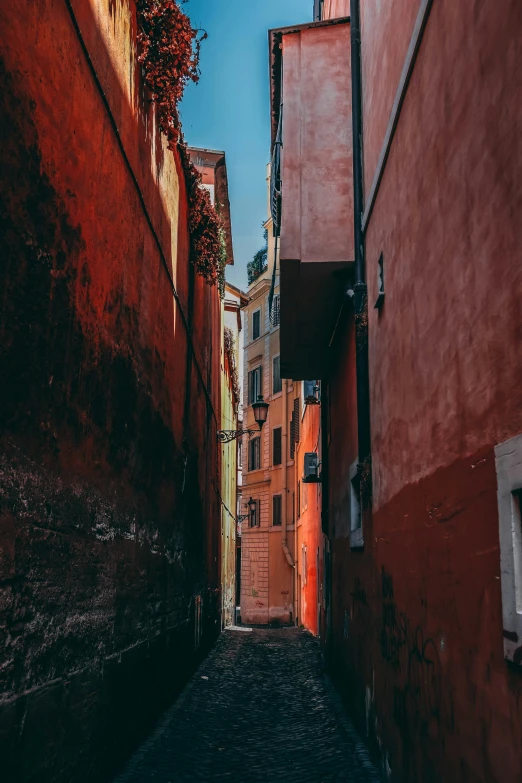 alley way leading to several buildings, buildings, and steps