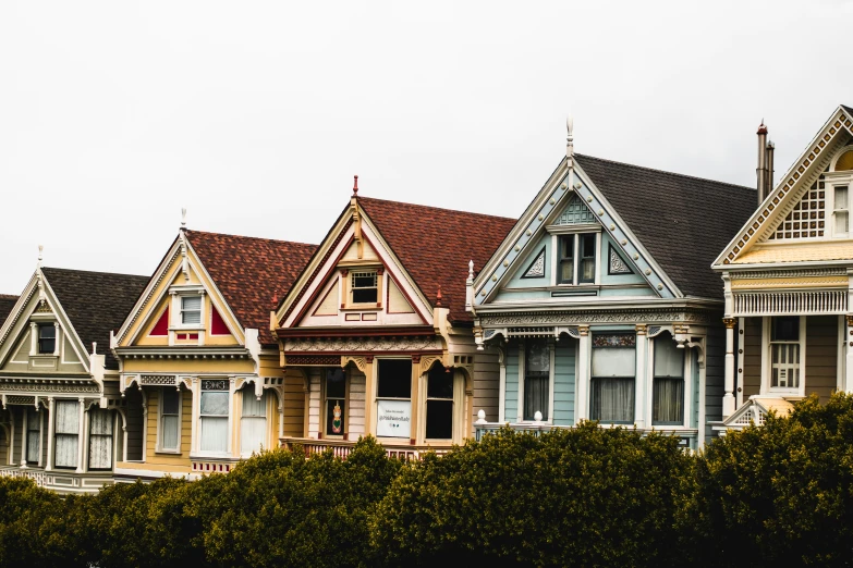 rows of painted houses with a flag on them