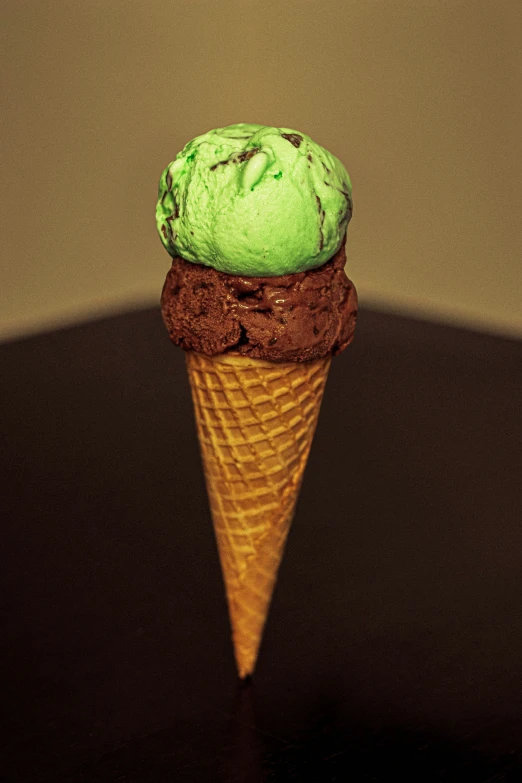 a scoop of ice cream sitting inside of an ice cream cone