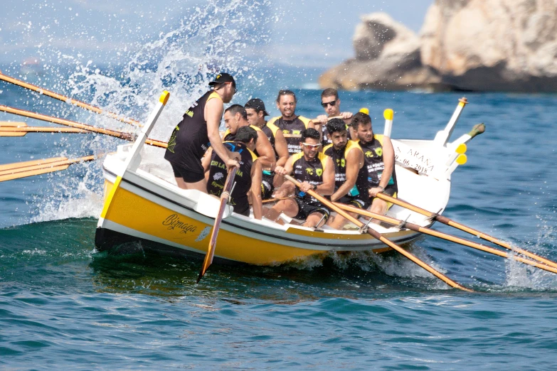 a group of young people in a boat on the water