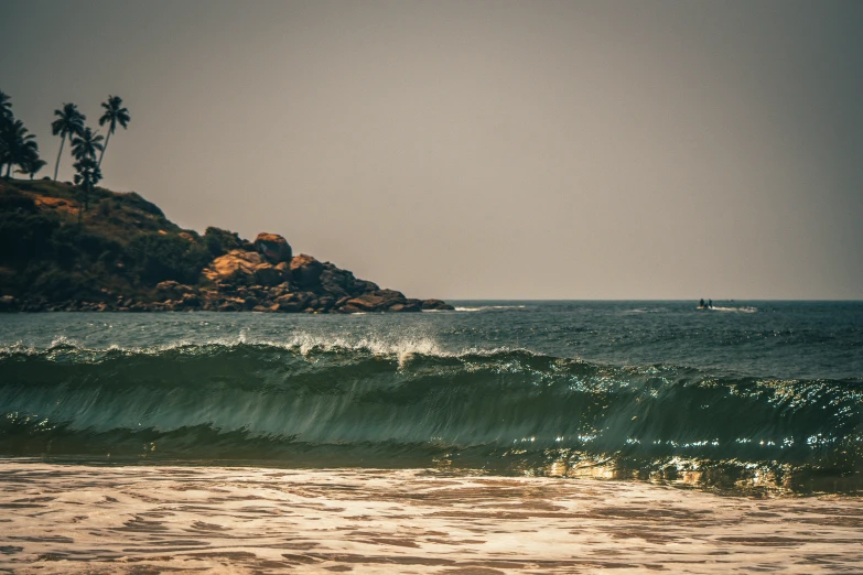 a view of an island off the shore from a beach