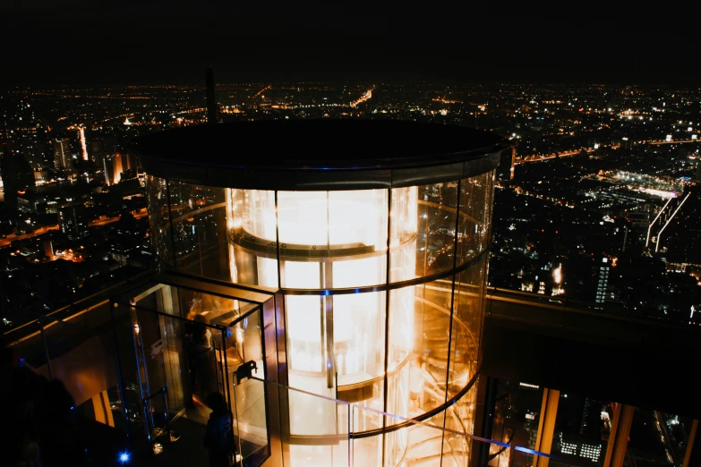 an observation tower on the top of a tall building in the city