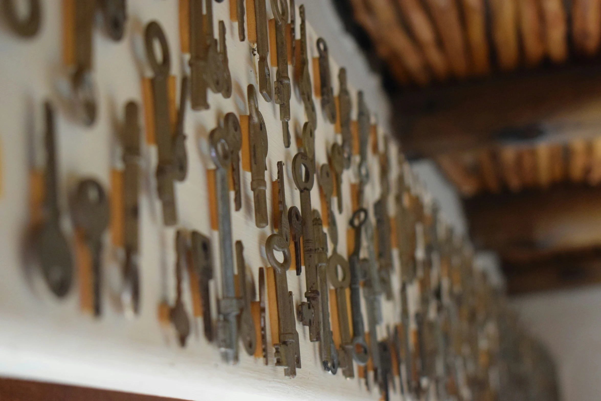 a wall with decorative metal pieces mounted to it