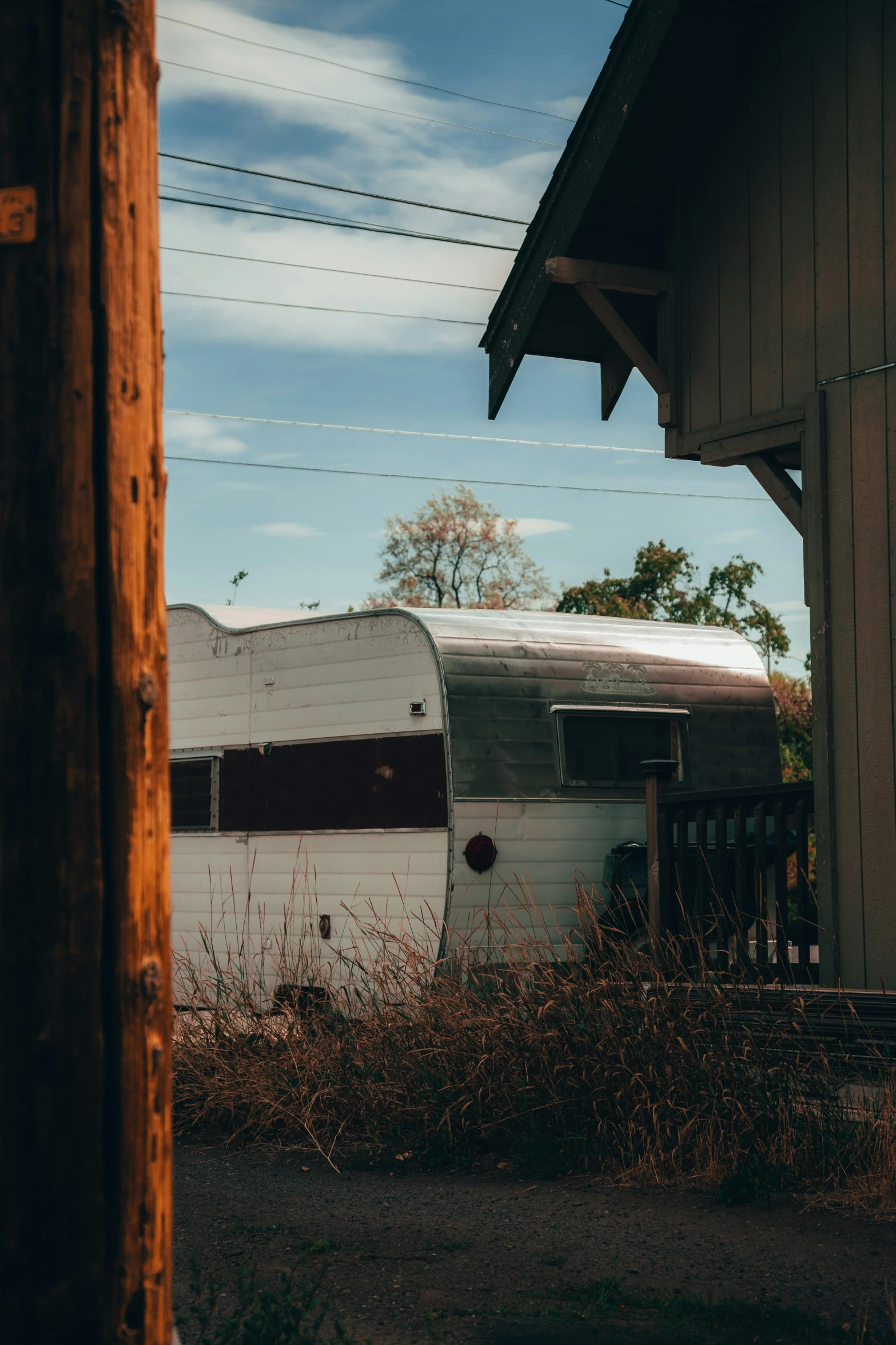 an old truck sits parked next to a house