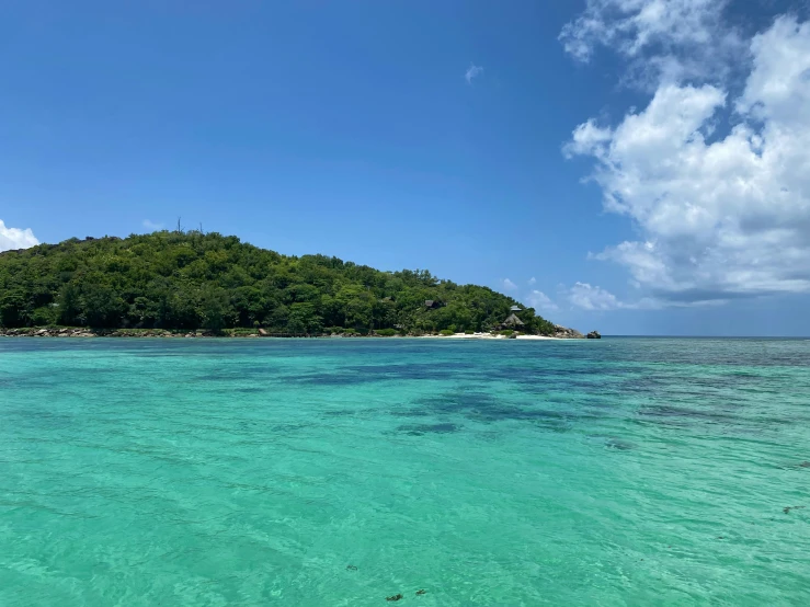 an empty beach with the water crystal clear