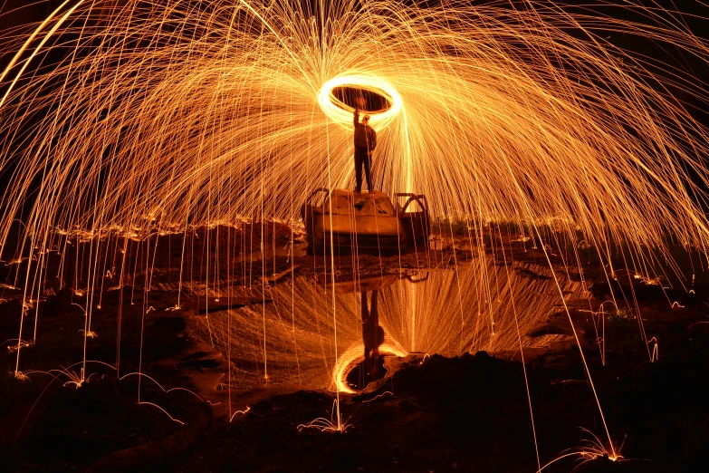 a firework shows up through the dark sky