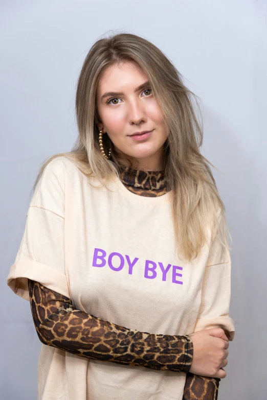 a woman wearing a shirt with a leopard print arm warmer