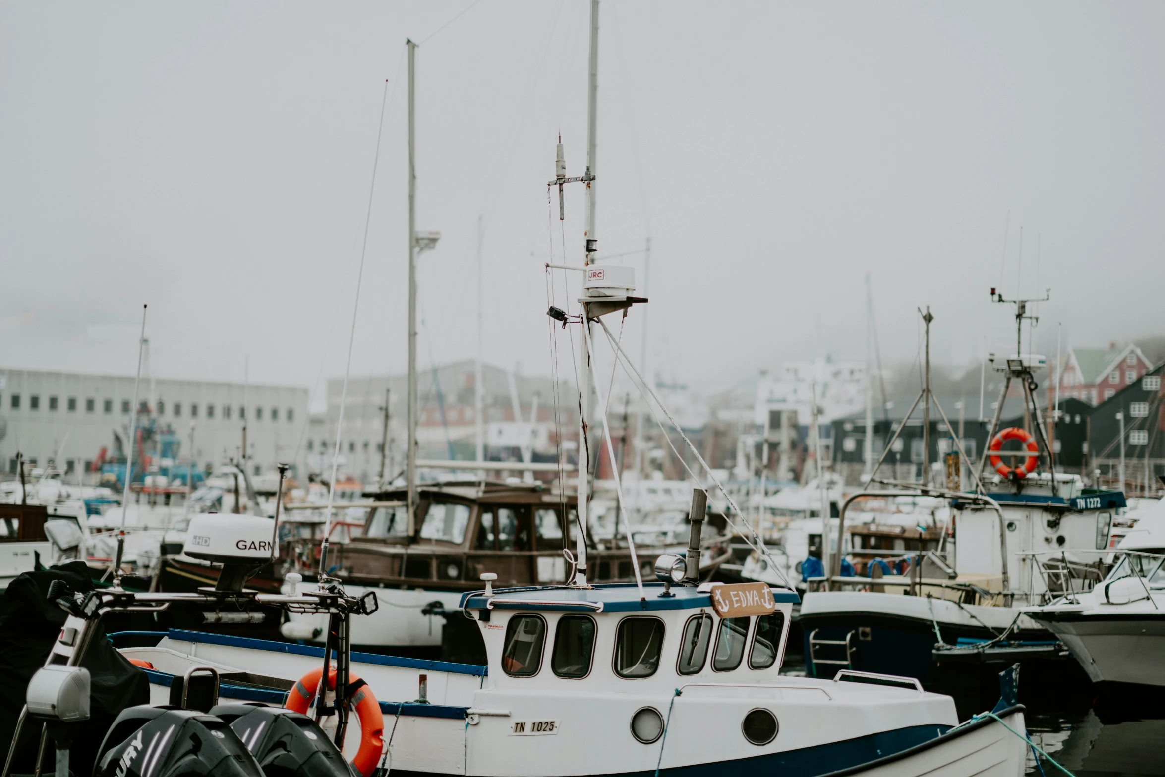 there are many boats docked at the marina