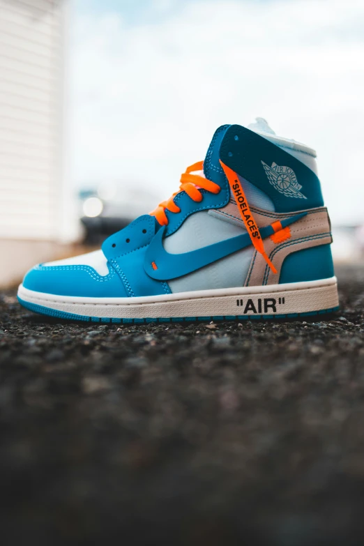 the air jordan 1 high is painted blue and orange