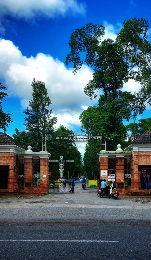 a road with people walking near the buildings