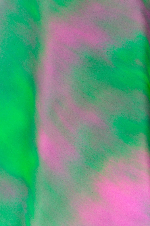 a long sleeved shirt with pink and green colors