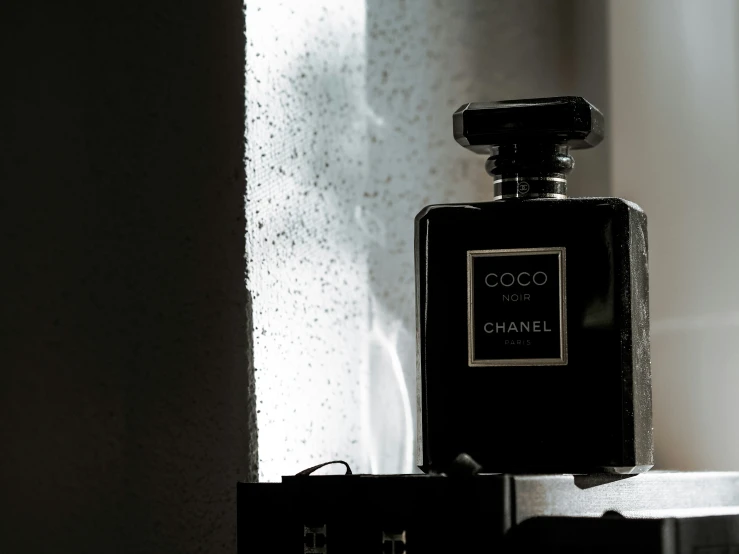 a bottle of coco noir perfume on a table
