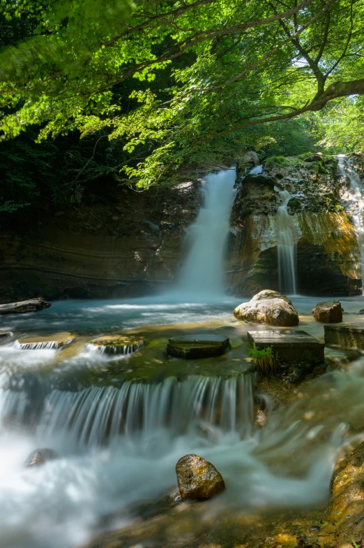 waterfall in a natural area during the day