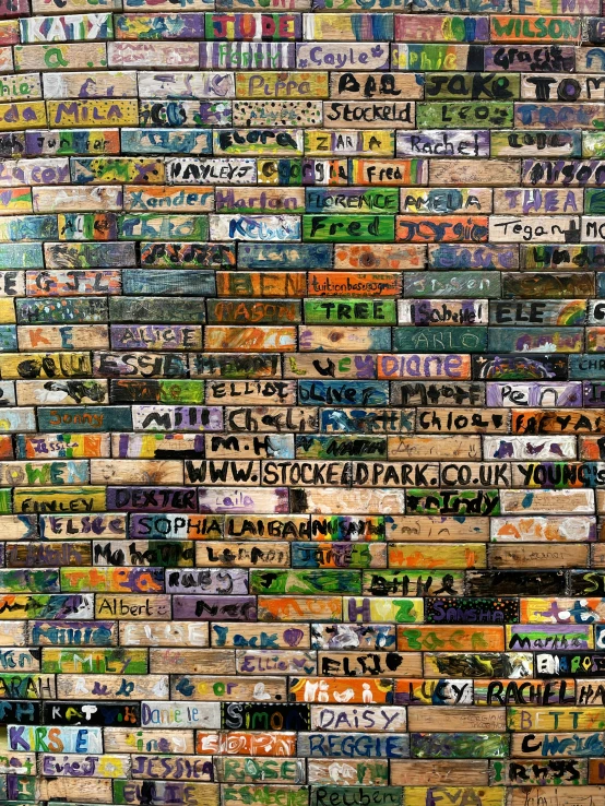 the wall is made out of multiple kinds of license plates