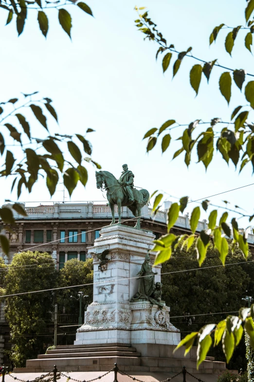 the sculpture is in front of a building that appears to be part of a building