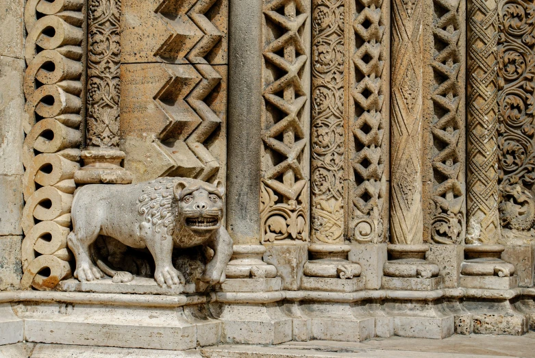 a statue of a sheep on the side of a building