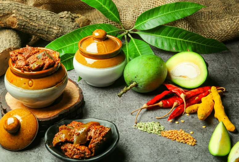 bowls and spices sit on top of a table