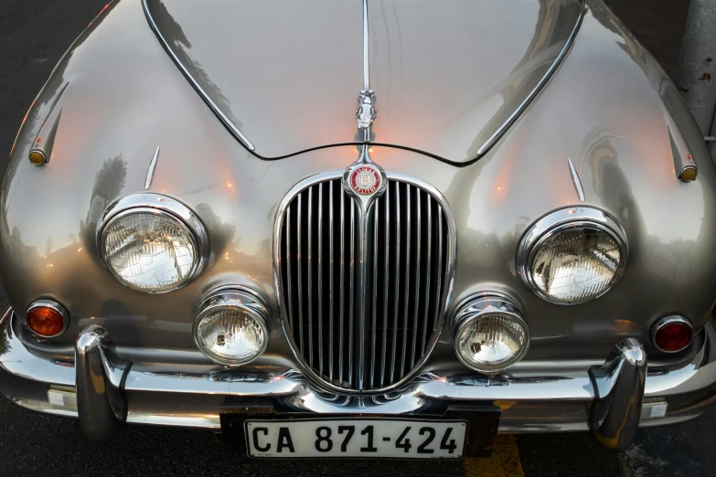 closeup on the front end of a chrome jaguar car