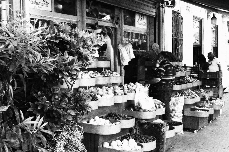 some people and baskets of food on the street