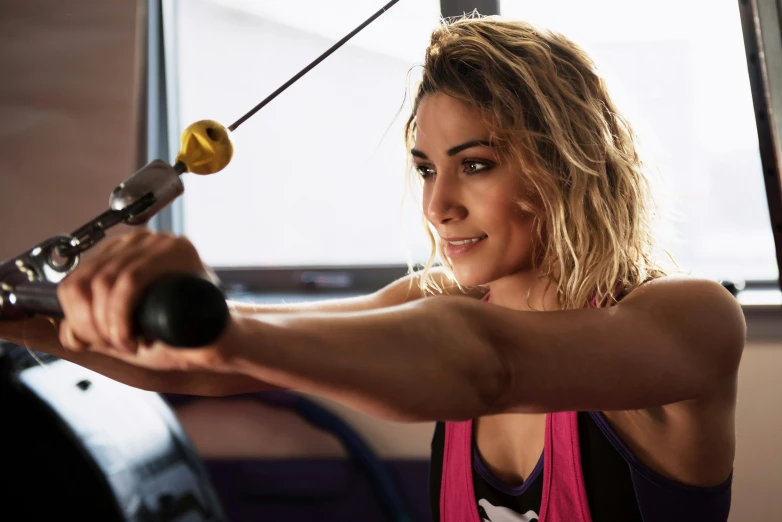 a woman doing exercises at the gym