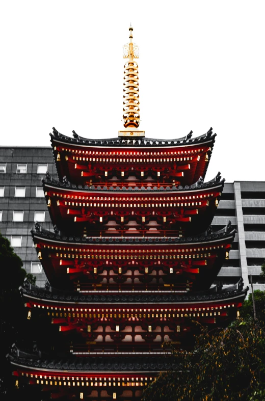 a tall oriental tower with a light fixture in it's middle