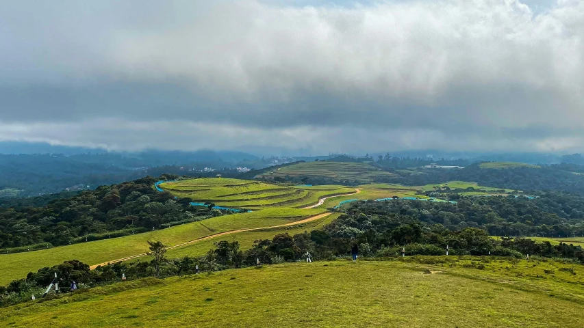 a view looking down a hilly valley