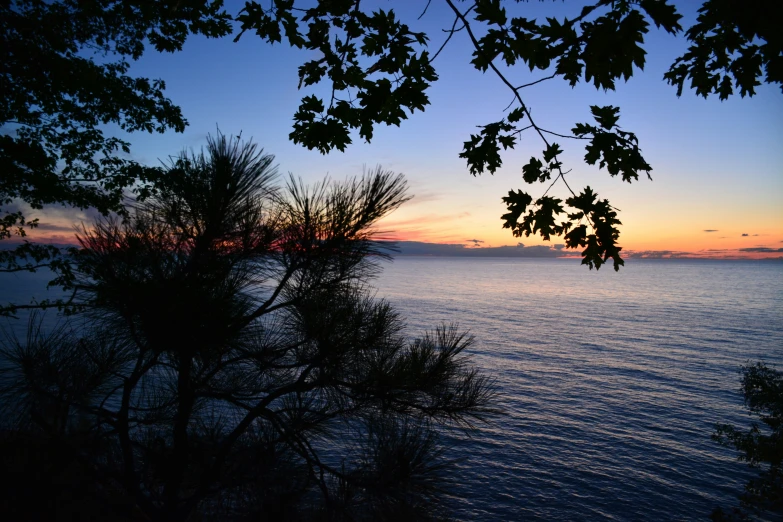 a po taken at dusk, looking out over the ocean from the shore