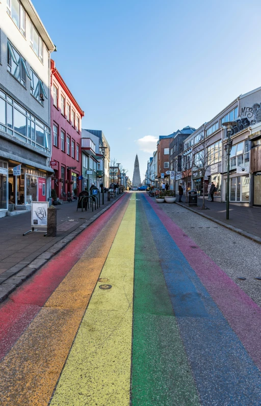 this is a rainbow colored sidewalk in a town