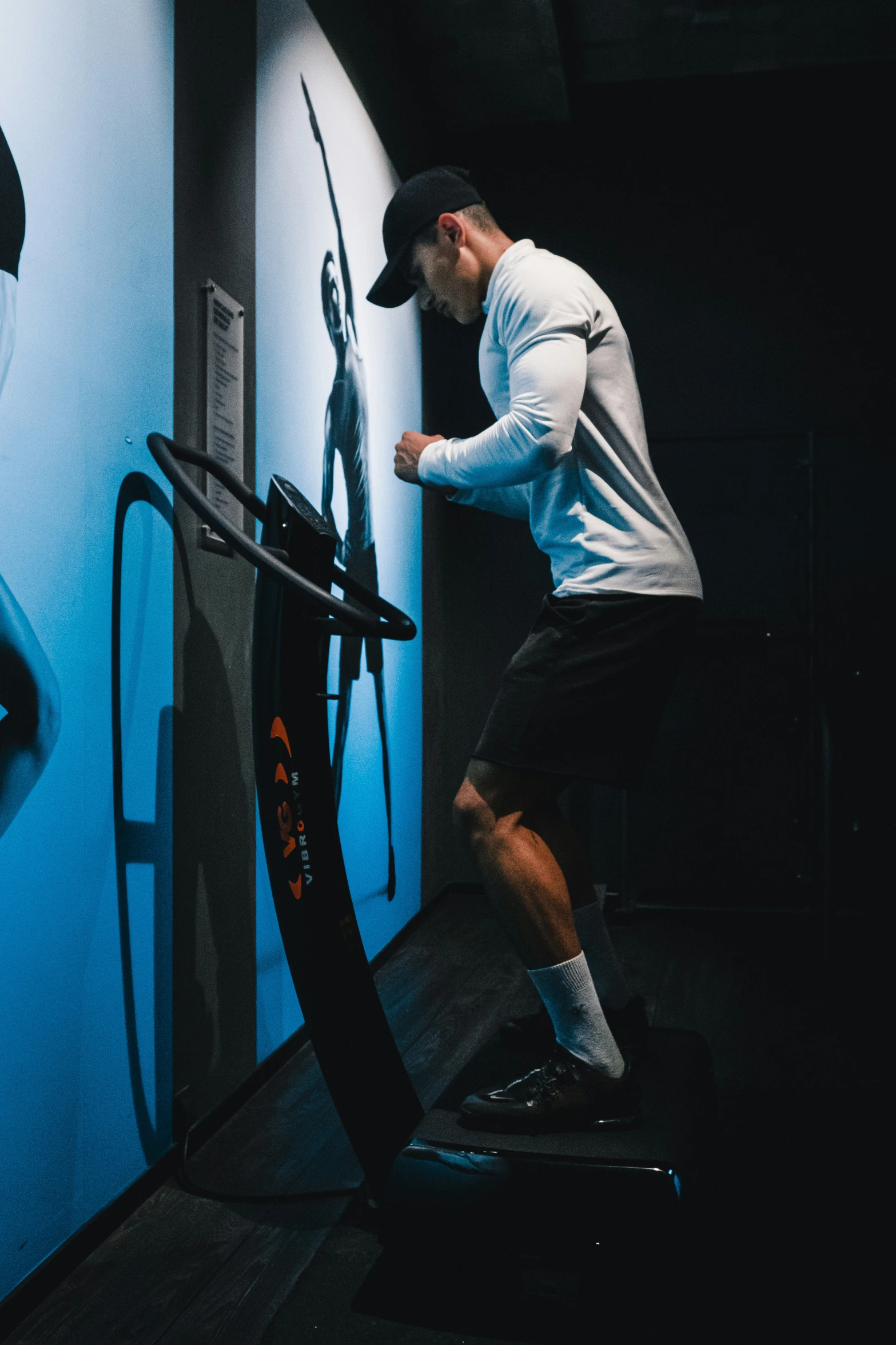 the man is doing exercises on the exercise bike