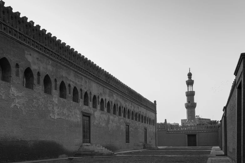 a tall tower towering over an old city