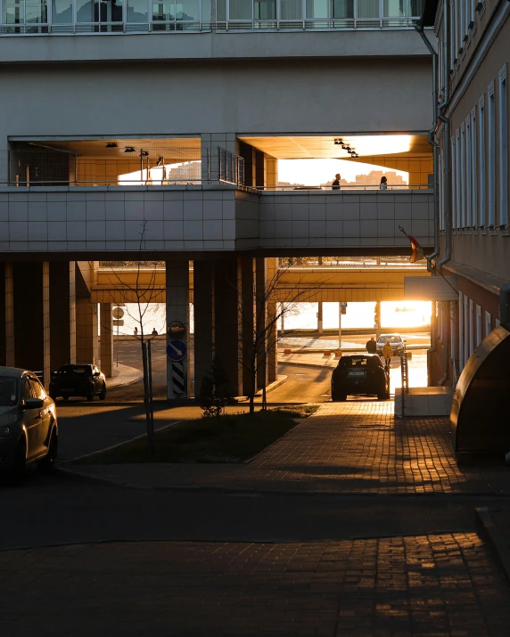 two cars parked in the parking lot near a building