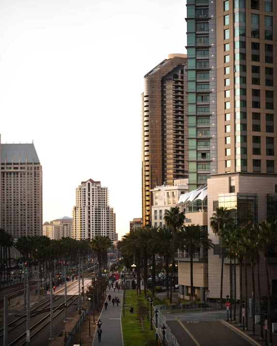 a view of some tall buildings near water