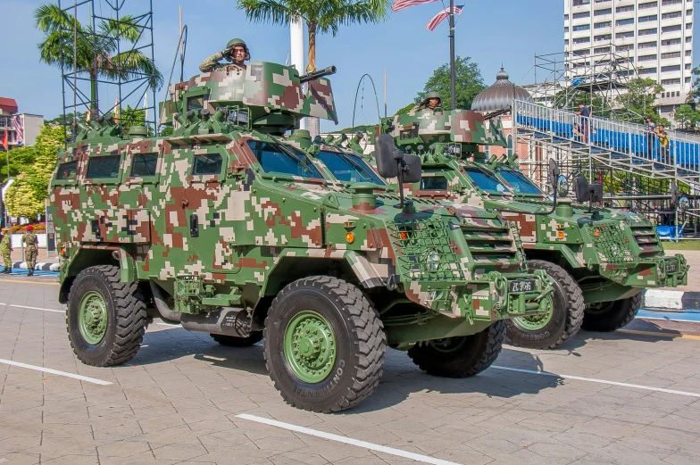 two military trucks are decorated with many colors