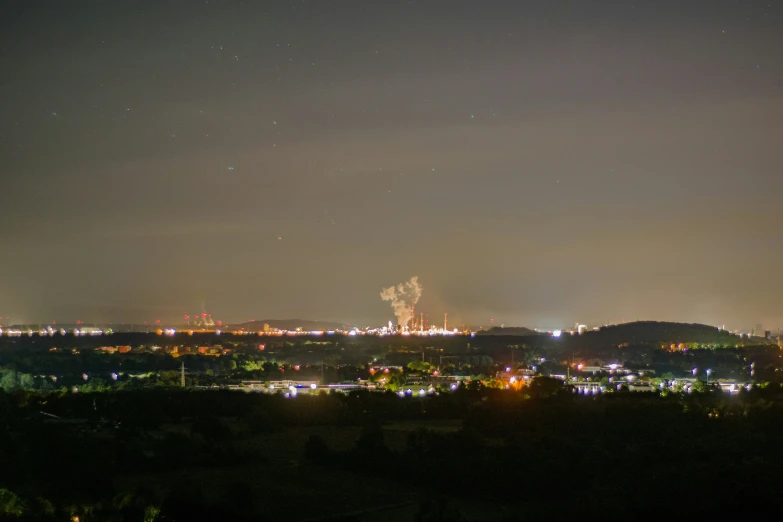 a view of some city lights from a hill