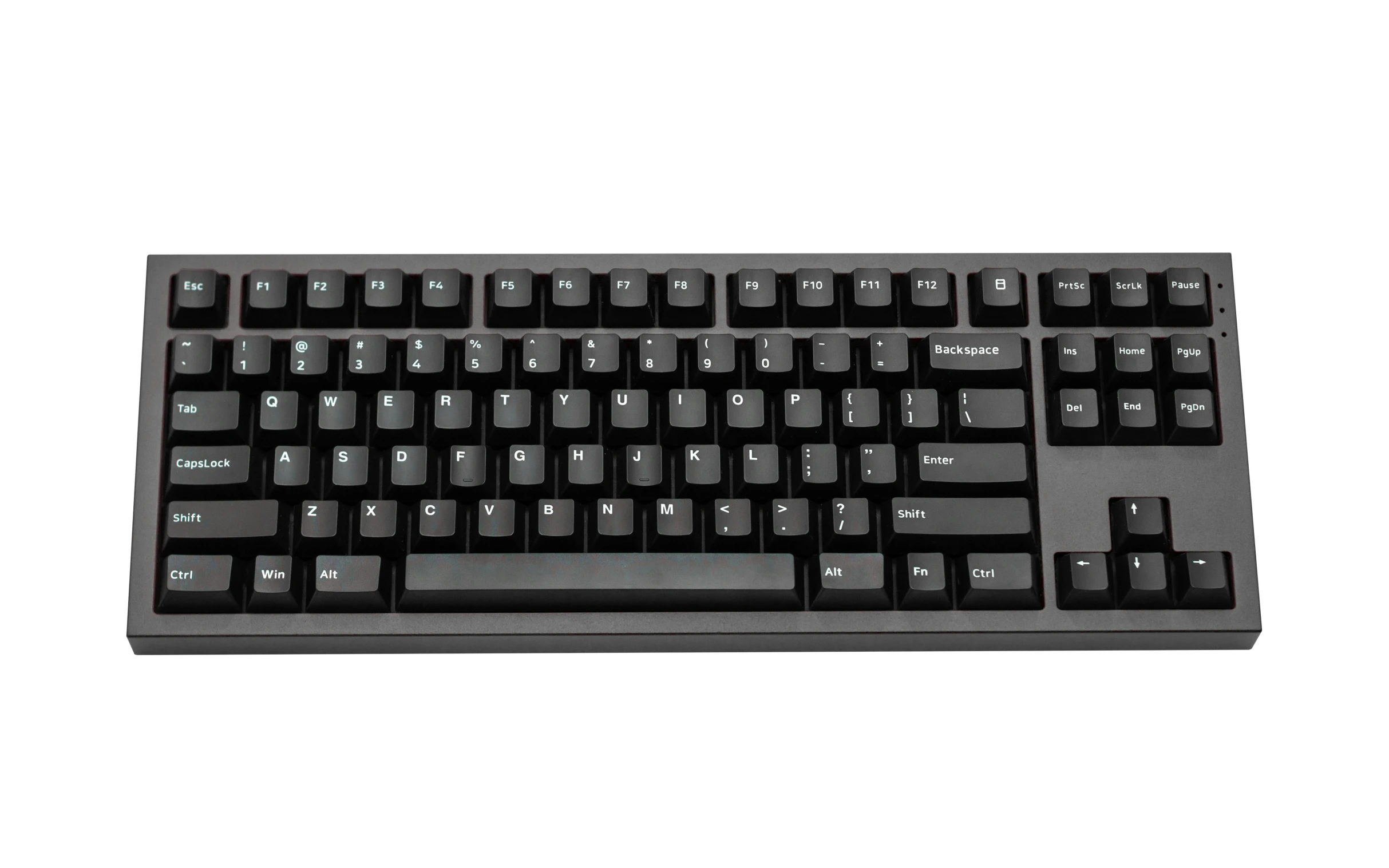 a computer keyboard is pictured on a white surface