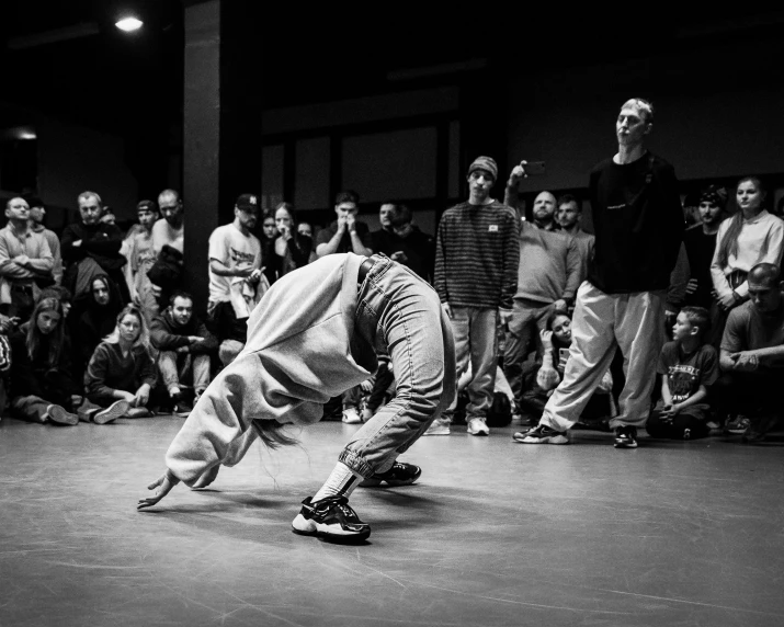 a man riding a skateboard down the middle of a floor