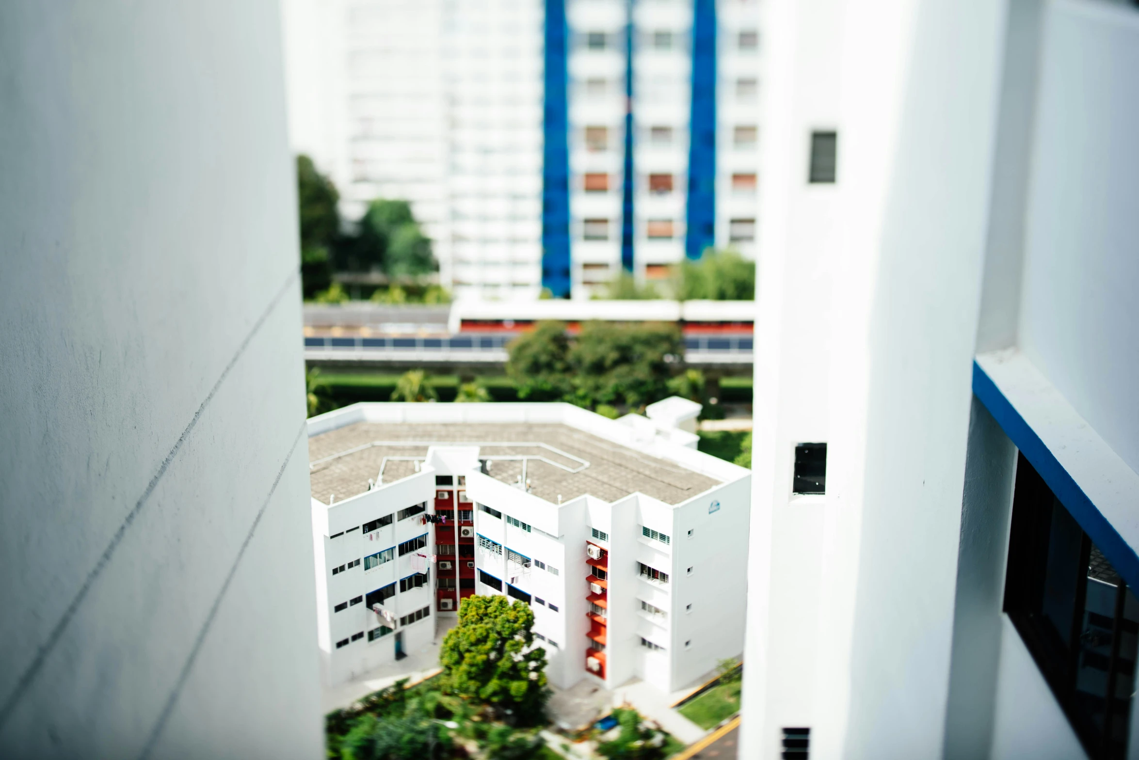 view of an apartment building through an open doorway