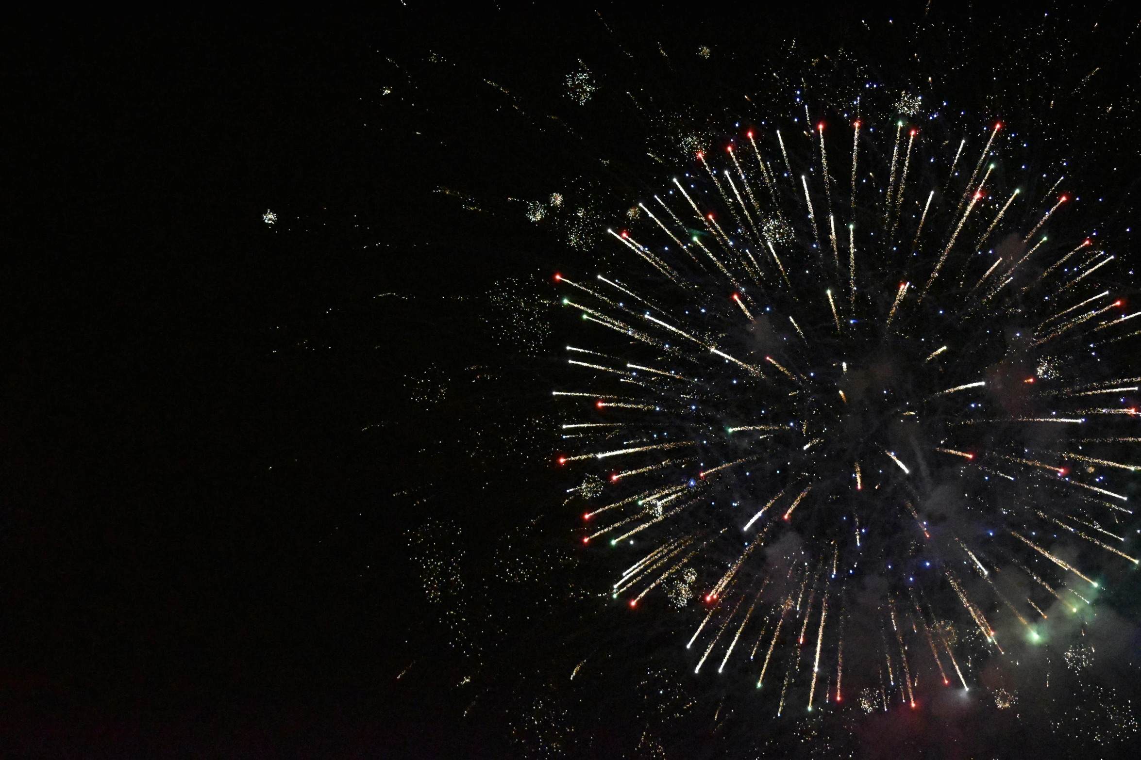 fireworks in the night sky with many colors and sparkles