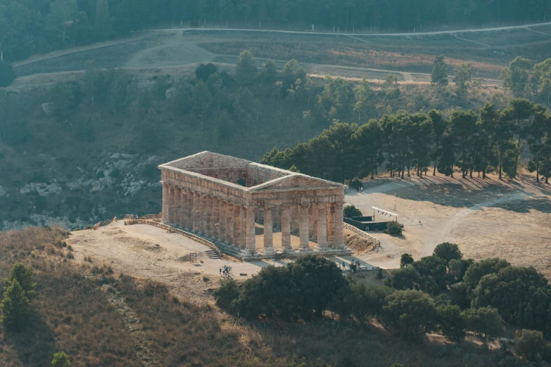 a large building that is sitting on a hill