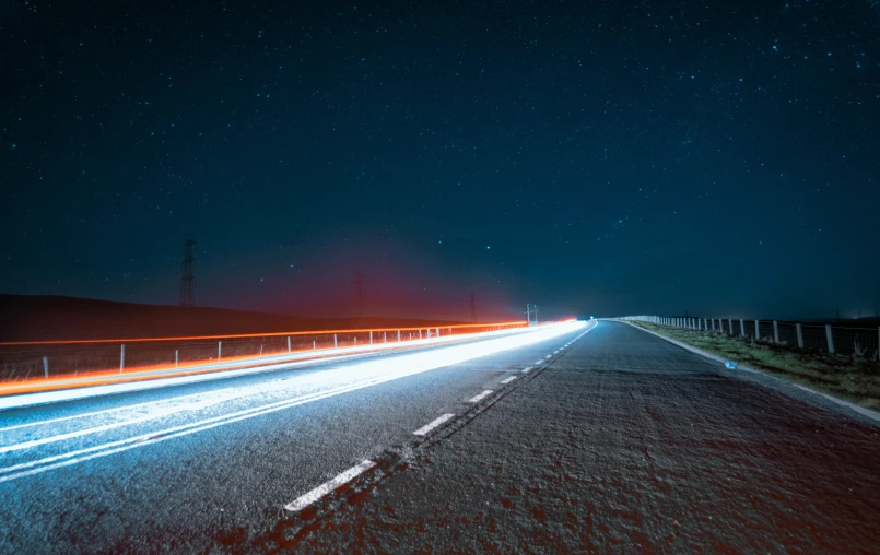 cars on the road at night with long exposure