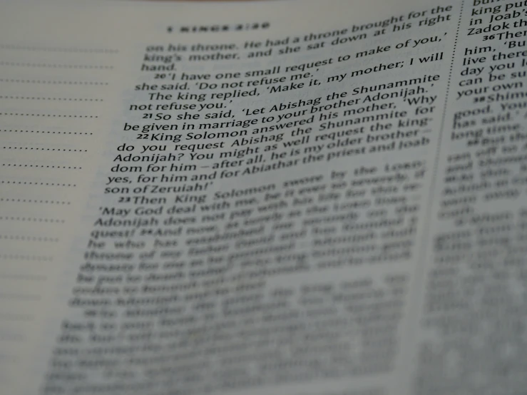 a open bible is shown with the word john