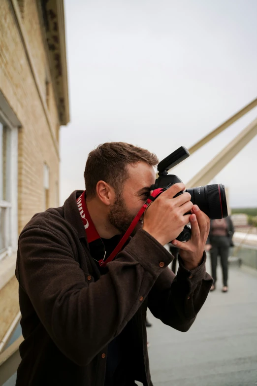 a man taking pictures of his reflection on the camera