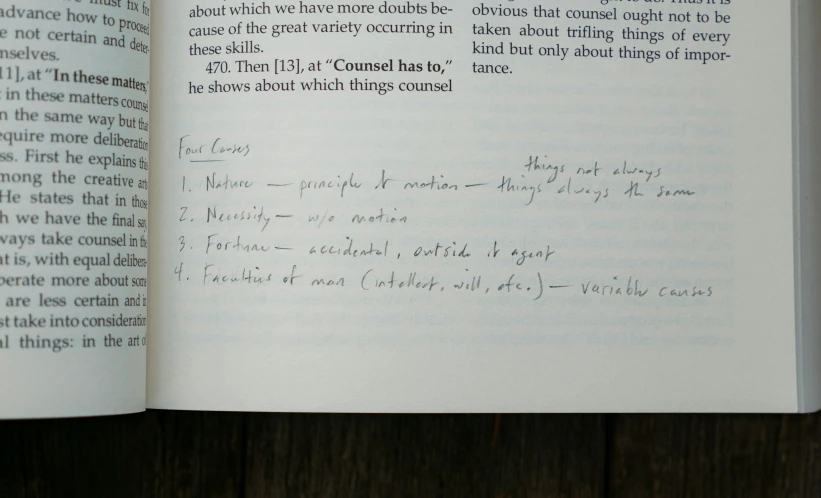 a close up of a book open with handwriting on it