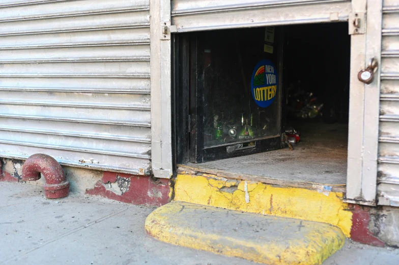 a door and some yellow pipes on the street