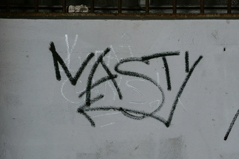 black and white pograph with the word nasty written below